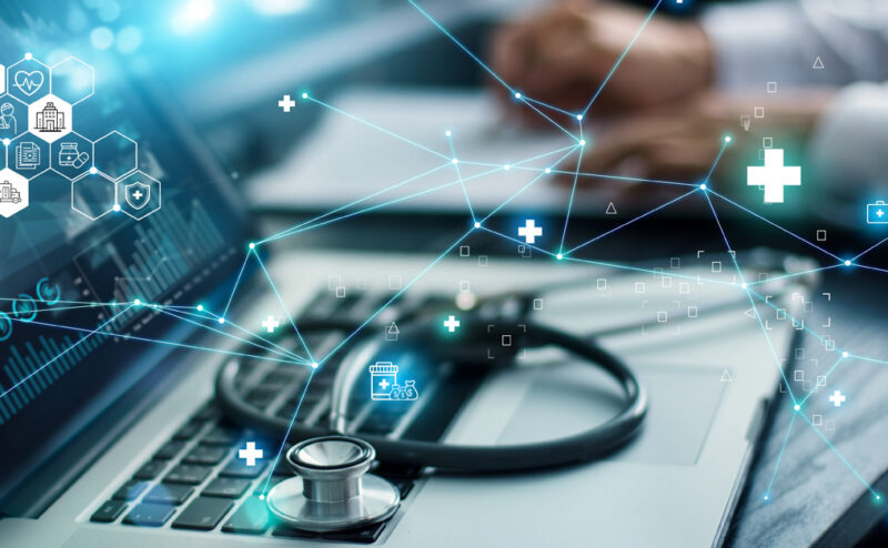 The foreground of this photograph shows a stethoscope resting on a laptop, with the hands of a medical provider seen in the background making notes. A series of interconnected symbols over overlaid on the phot, representing products, processes, and audiences in pharma marketing and CDMO marketing